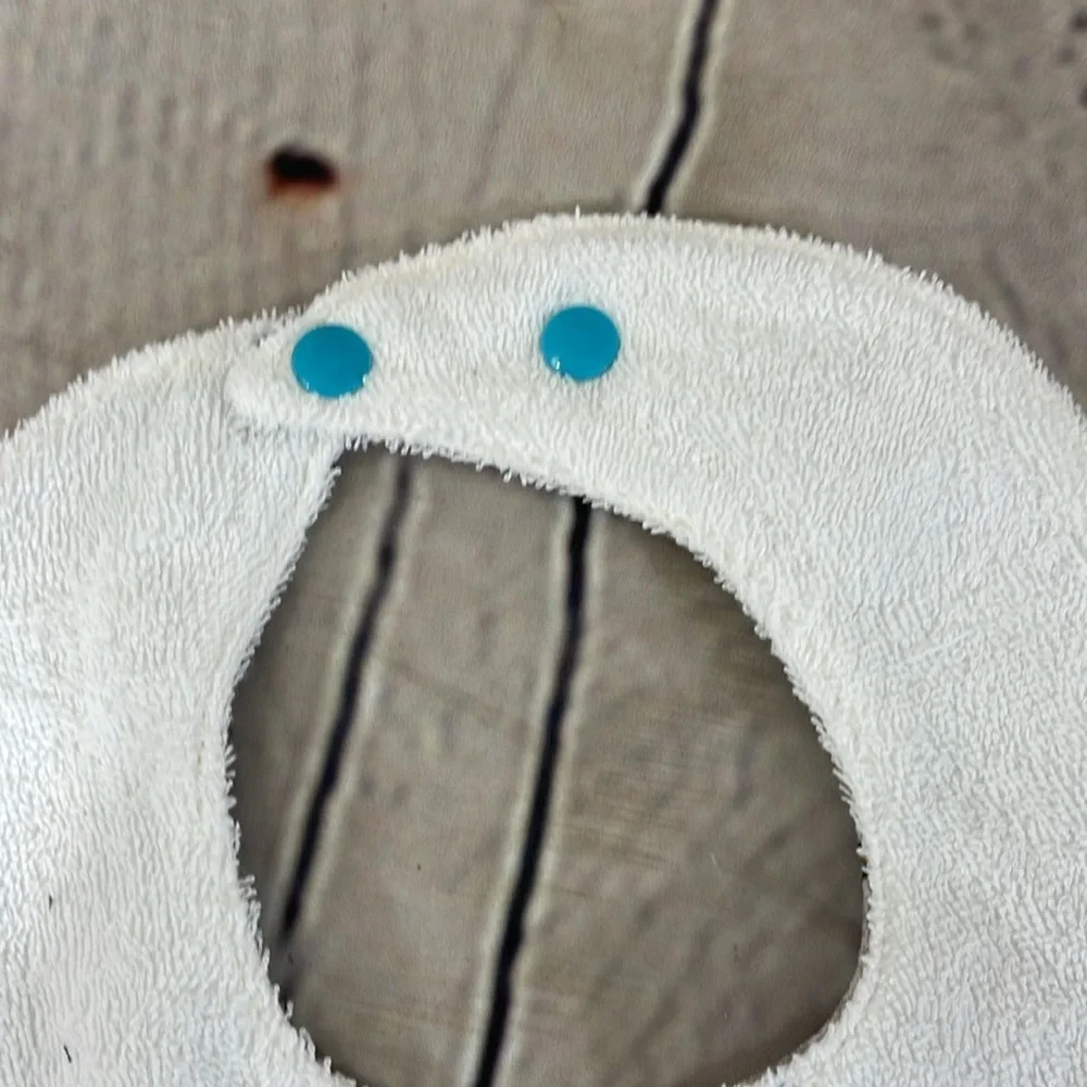 Designer handcrafted dinosaur bib